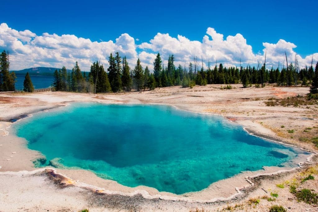 Which national park is better Yellowstone or Grand Teton? 1 Yellowstone Hot Springs Clear Day